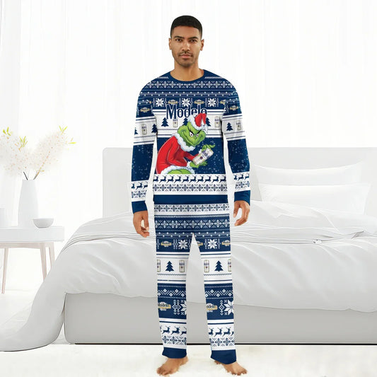 Man wearing Modelo Santa Grinch Family Pajamas with blue and white festive pattern and Grinch holding Modelo beer