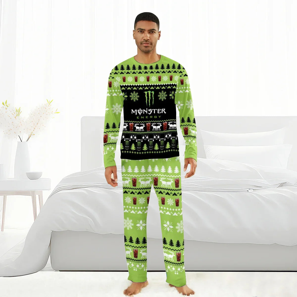 Man wearing green Monster Energy themed Christmas pajamas with snowflakes and reindeer in bright bedroom