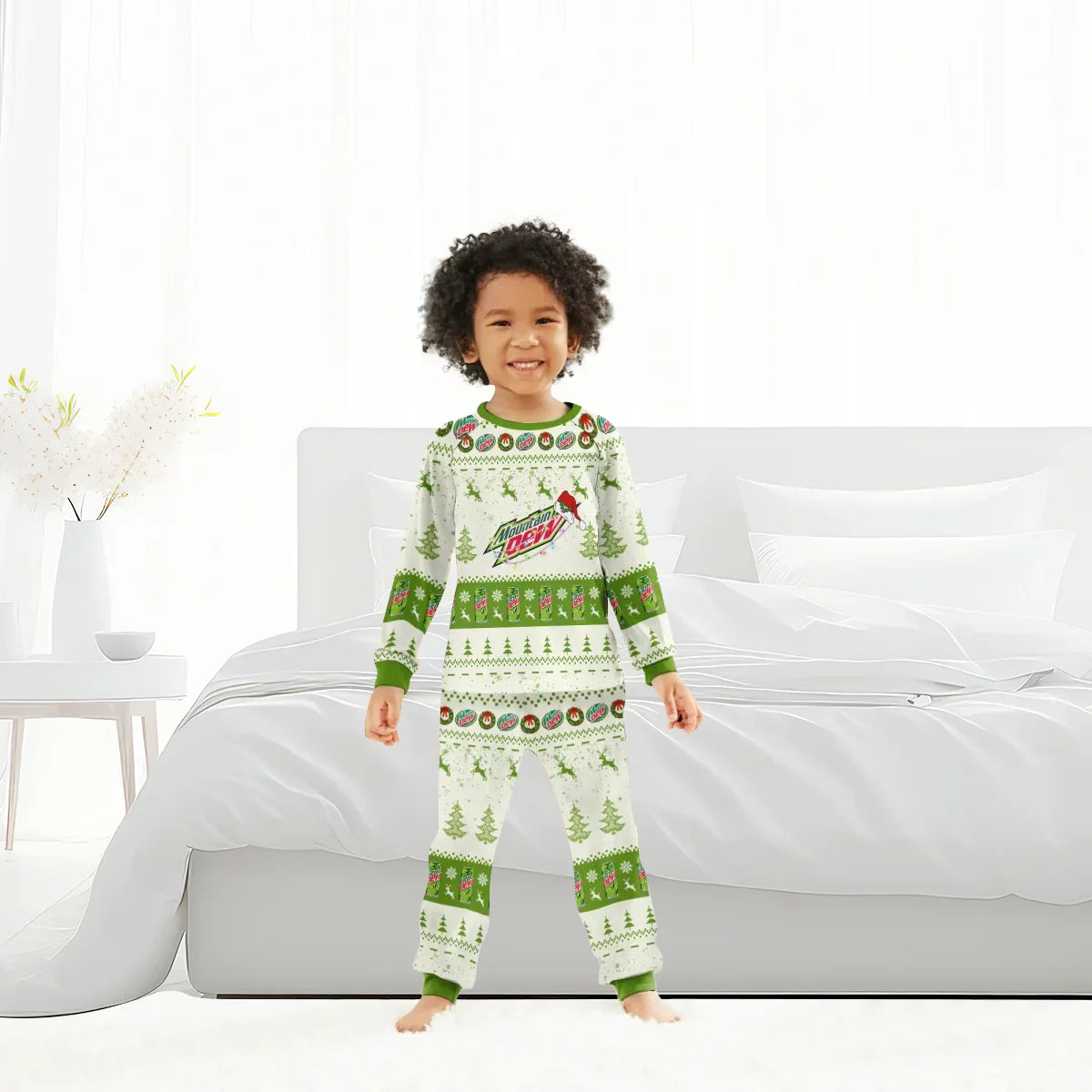 Child wearing Mountain Dew Christmas pajamas with reindeer and tree patterns in bright bedroom
