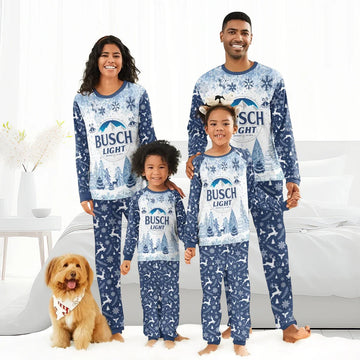 Smiling family in matching blue Busch Light Christmas pajamas with winter snowflake and reindeer patterns, indoor setting