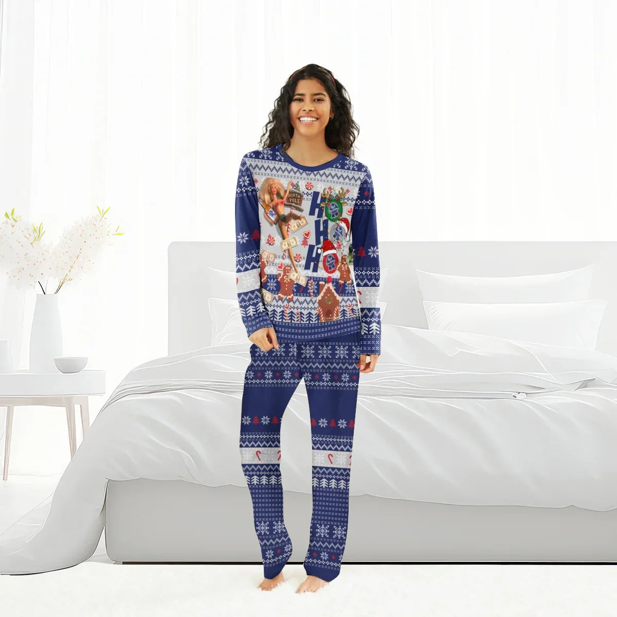 Smiling woman in blue Pabst Blue Ribbon Christmas pajama set with Ho Ho Ho and holiday graphics in bright bedroom