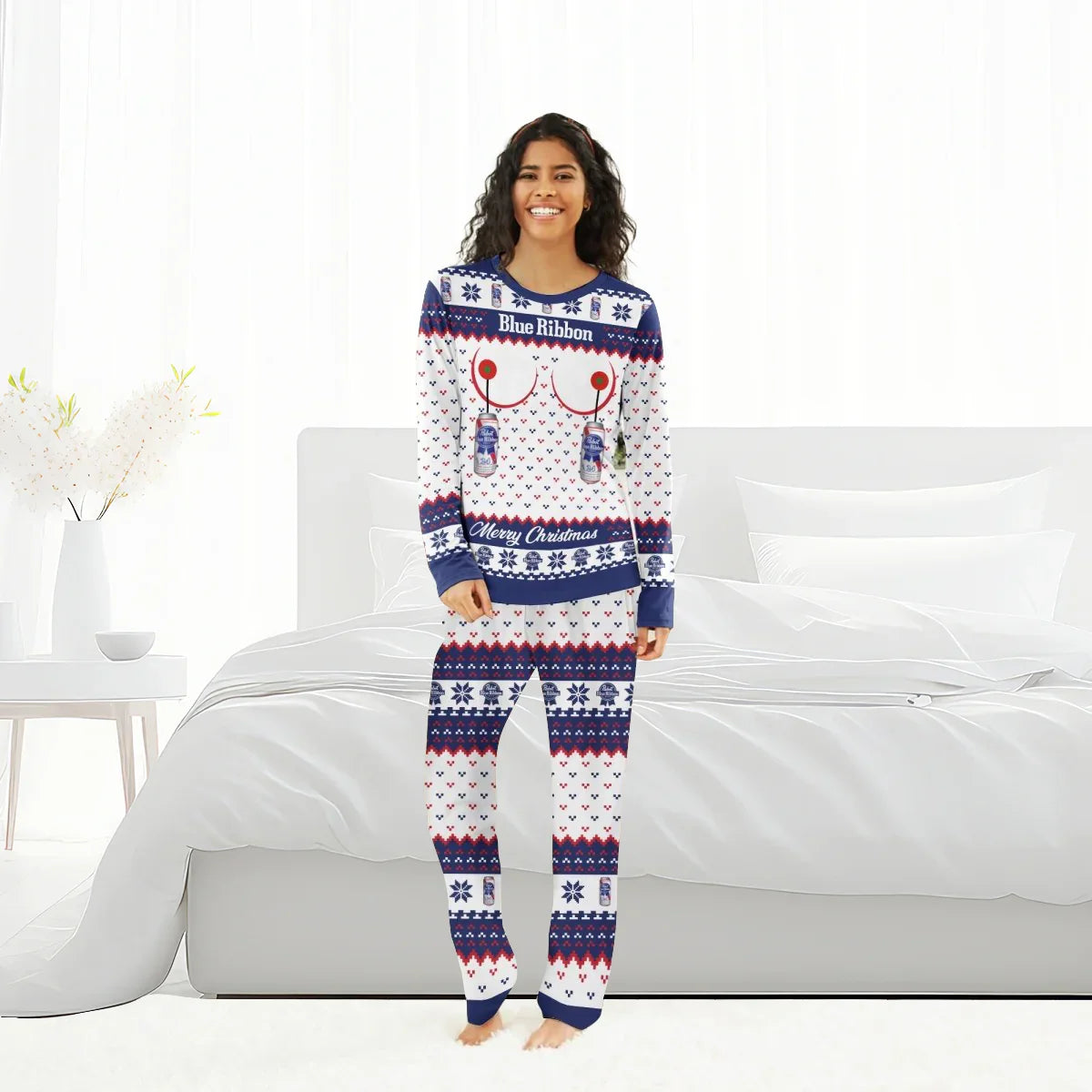 Smiling woman in Pabst Blue Ribbon Merry Christmas holiday pajama set standing in bright bedroom