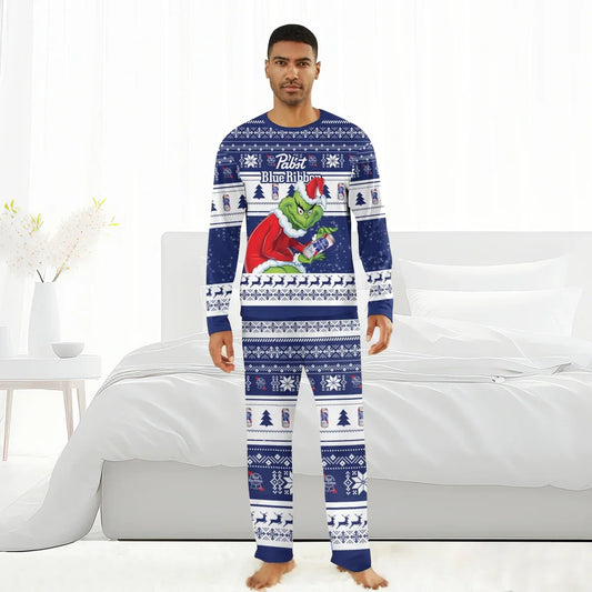 Man wearing Pabst Blue Ribbon holiday pajamas featuring the Grinch in Santa outfit holding a beer can