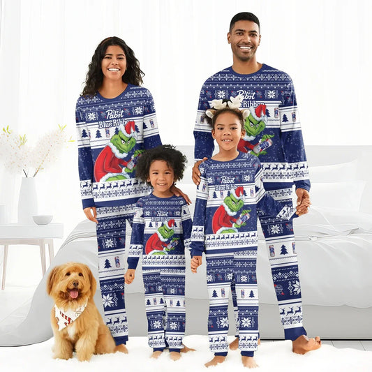 Smiling family wearing matching blue Pabst Blue Ribbon Grinch Christmas pajamas with snowflakes and reindeer, dog with bandana