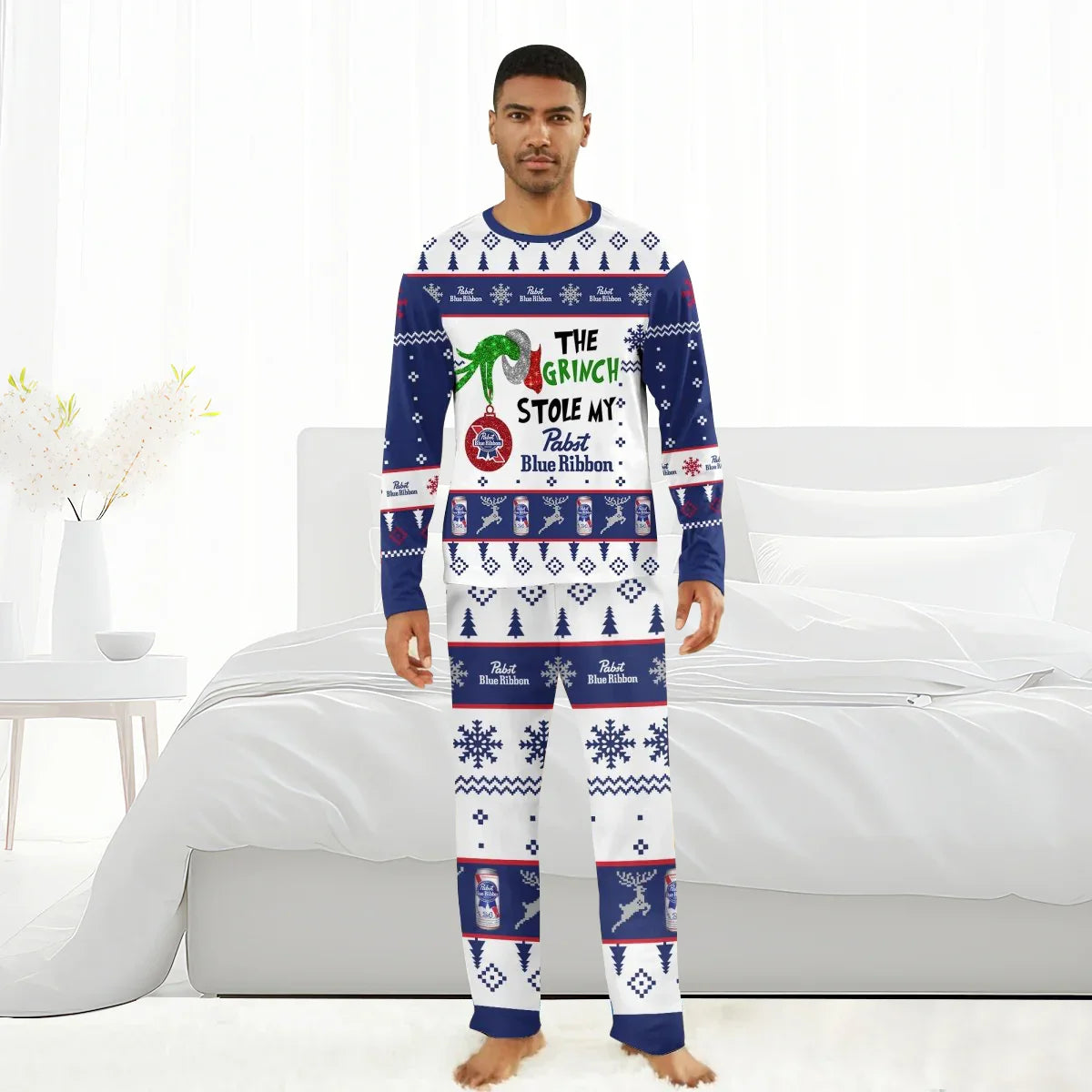 Man wearing Pabst Blue Ribbon and Grinch-themed Christmas pajama set in white and navy blue