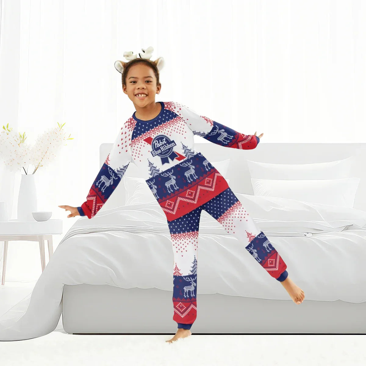 Child wearing red white blue Pabst Blue Ribbon winter reindeer family pajamas in bedroom