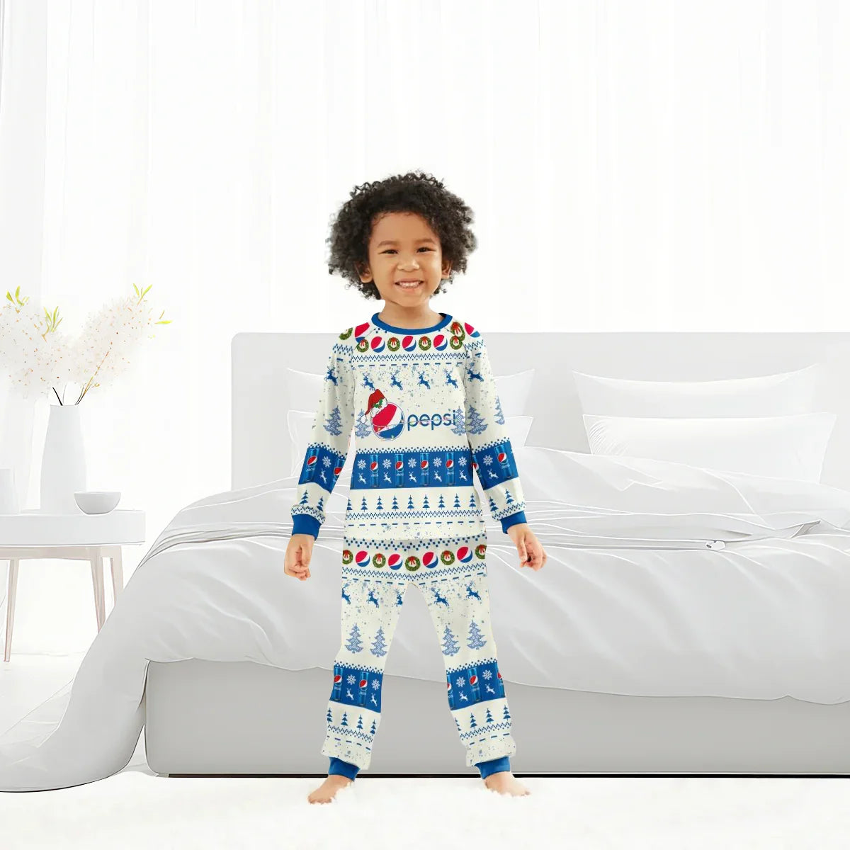 Smiling child in Christmas-themed Pepsi reindeer family pajamas in bright bedroom