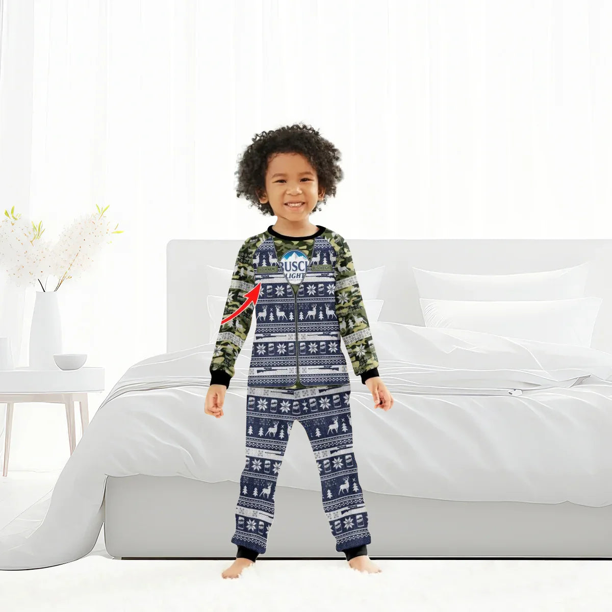Smiling child in camo and navy blue Christmas pajamas with Busch Light logo, standing in bright bedroom