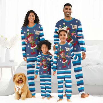 Family wearing matching blue striped Christmas pajamas with personalized elf faces and "Make Christmas Drink Again" text