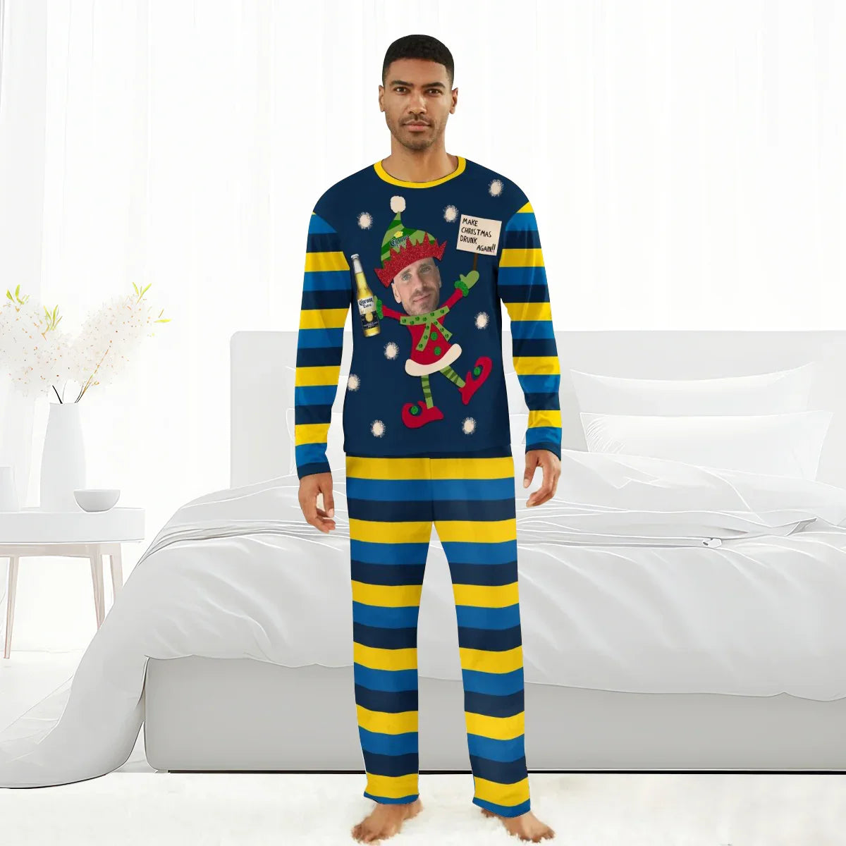Man in blue and yellow striped Christmas pajamas with elf holding Corona beer and festive message