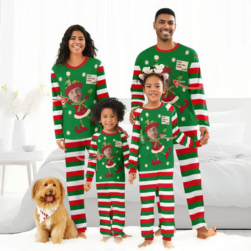 Family of four wearing personalized Christmas elf pajamas with striped red, green, white patterns and dog with holiday bandana