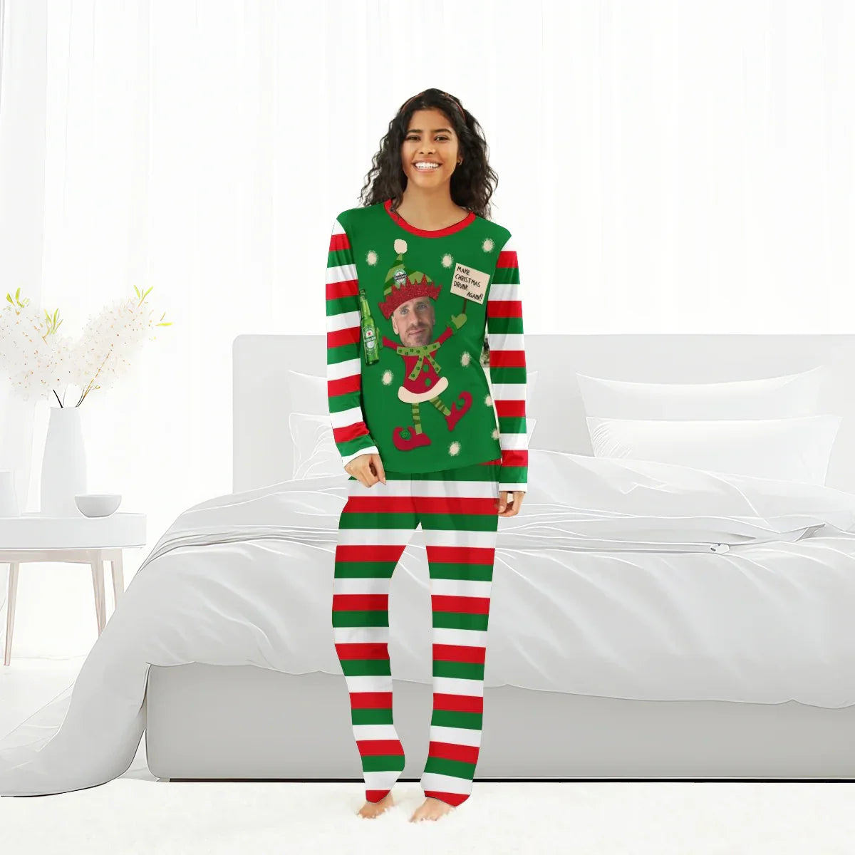 Smiling woman wearing personalized Heineken holiday pajamas with elf design and striped red, green, white pants