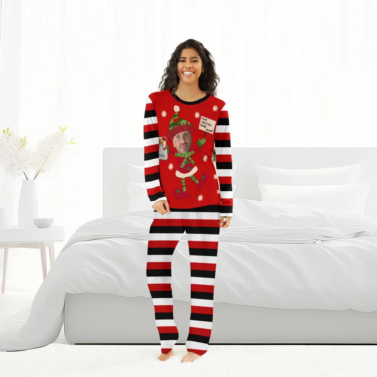 Smiling woman in red, black, and white striped personalized Christmas pajamas with festive elf and face print