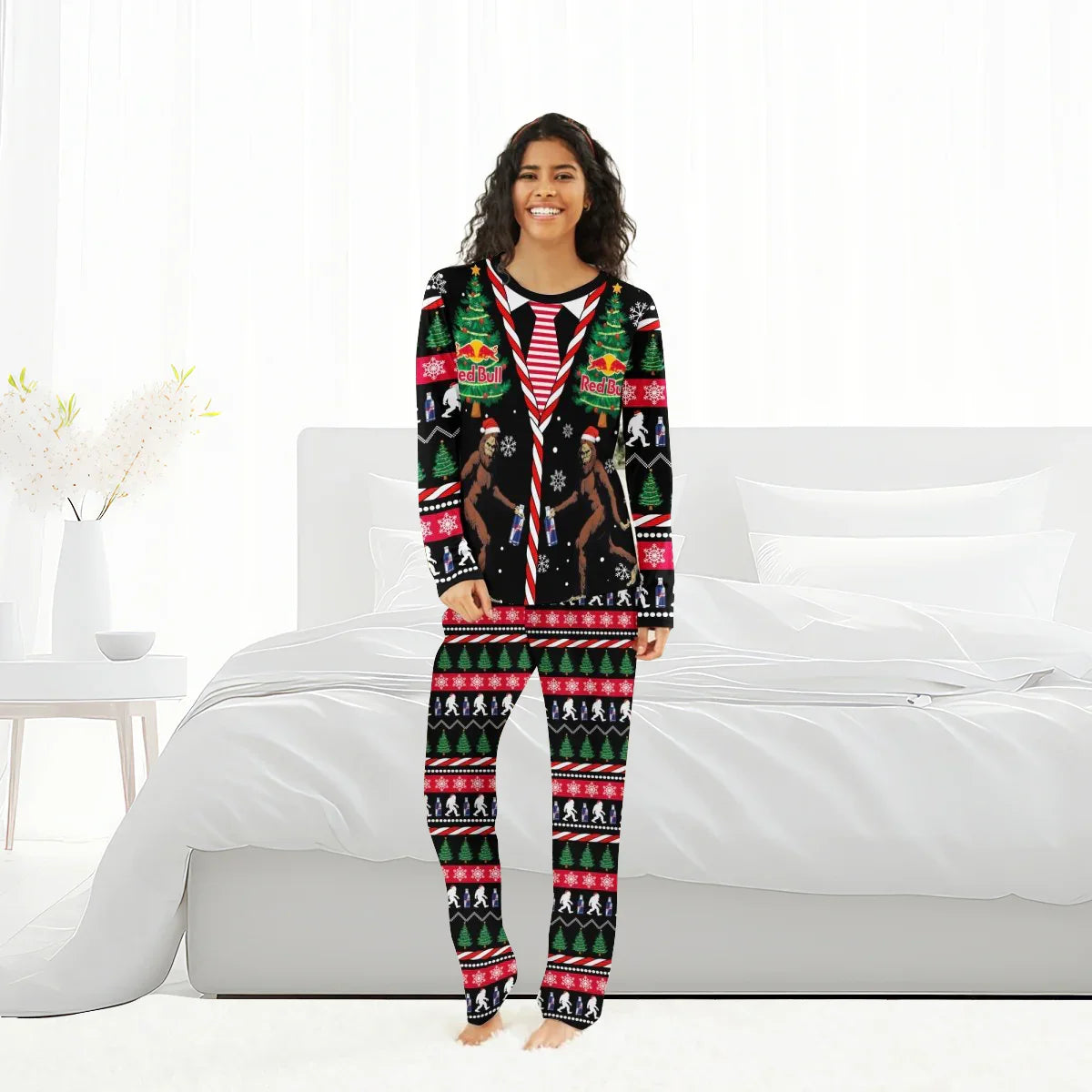 Woman wearing Red Bull Christmas Bigfoot family pajamas with holiday trees, snowflakes, and candy cane design