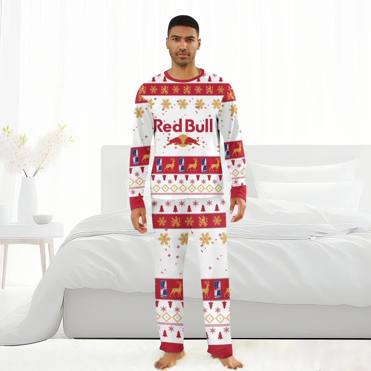 Man wearing Red Bull branded Christmas holiday family pajamas with festive red and gold patterns in a white bedroom