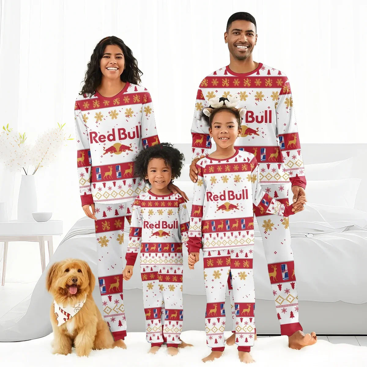 Family in matching Red Bull Christmas holiday pajamas with festive patterns, standing in a bright bedroom with a dog