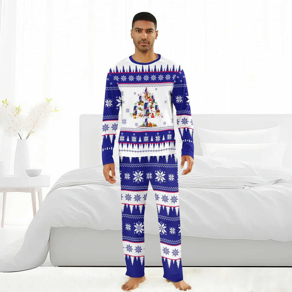 Man wearing blue and white Christmas pajamas with snowflake patterns and Red Bull Christmas tree design