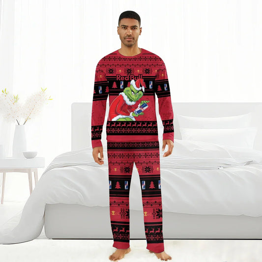 Man wearing red Christmas pajamas with Grinch and Red Bull design, standing barefoot in white bedroom