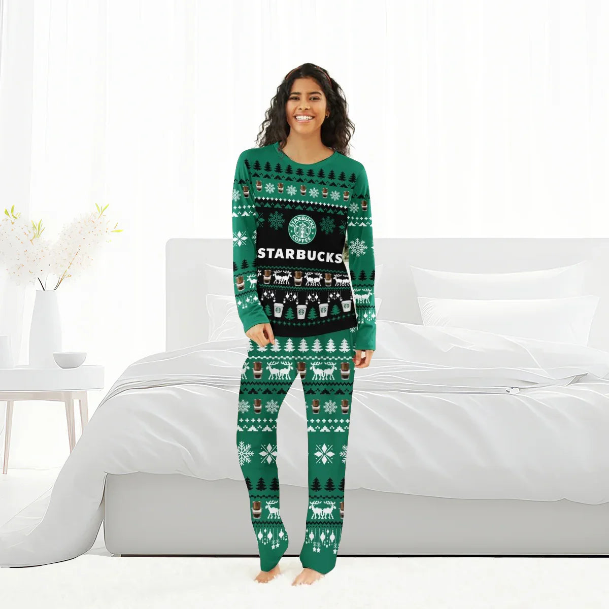Smiling woman in green Starbucks Christmas pajama set with holiday patterns in bright bedroom