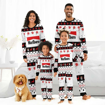 Smiling family in matching red, white, black Marlboro Christmas holiday pajamas with reindeer and snowflake patterns